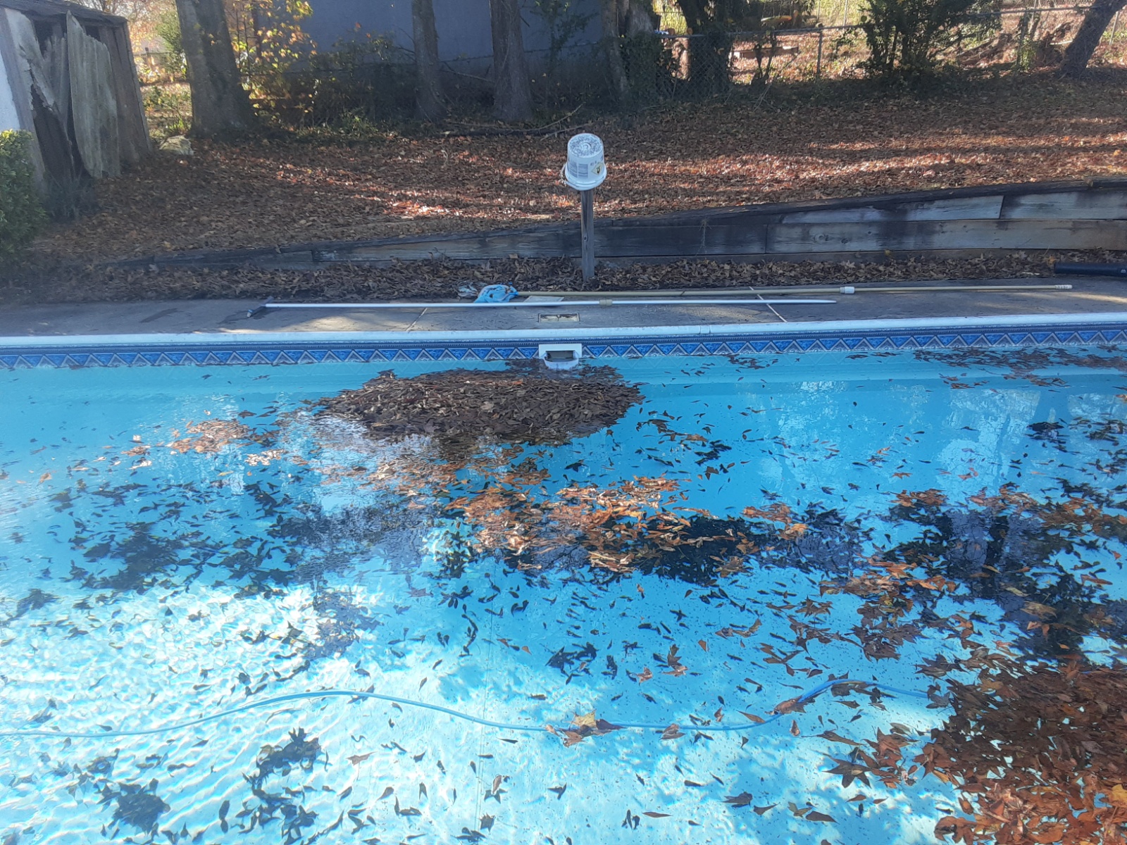 Skimmer Shield being installed in pool skimmer